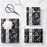 Hoja De Papel De Regalo Vacaciones de Black and White Merry Christmas<br><div class="desc">Negro y blanco moderno abstracto Árboles navideños feriados Hojas de papel envuelto. Muestra un lindo patrón de Navidades negros y blancos estilizados árboles en negro y el texto vertical "Feliz Navidad" en una franja blanca.</div>