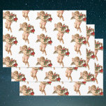 Hoja De Papel De Regalo Vintage Christmas, Victorian Angel con Floral Wrea<br><div class="desc">Imagen de fiesta religiosa de Navidades de ilustracion de época con un cherúb con alas sosteniendo una corona floral hecha de flores,  bayas y otras flores rojas. Una antigua morada victoriana cortada para ayudar a celebrar las festividades esta temporada.</div>