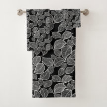 Hojas blancas con toalla negra