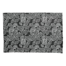 Hojas blancas en la funda de almohada negra