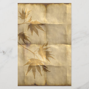 Hojas de arce de oro en papel de pergamino elegant