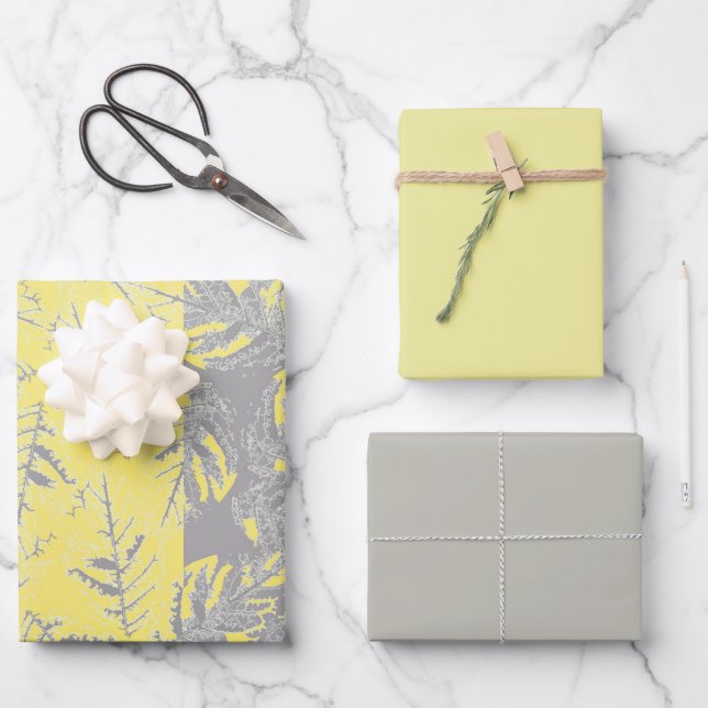 Hojas grises y amarillas en un fondo rayado. (Anverso)