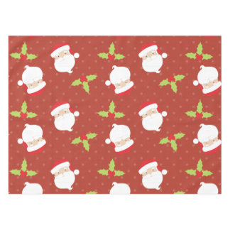 Holly y Santa Claus en el mantel festivo