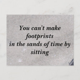 Huellas en la postal de arena