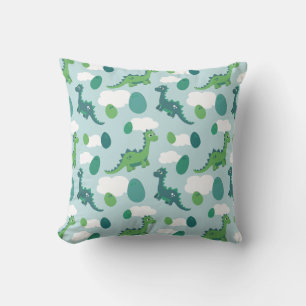 Huevos de dinosaurio en una almohada de lanzamient