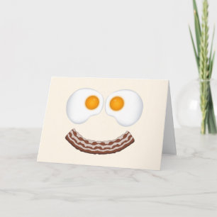 Huevos y tarjeta de felicitación de la mueca del