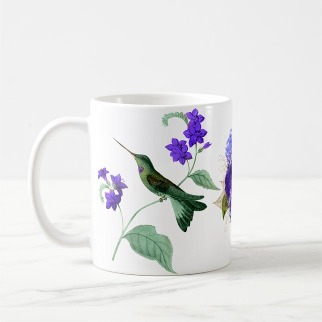 Hummingbird con flores moradas taza de café (Izquierda)