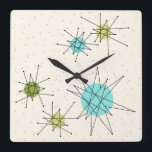 Icónico reloj de pared cuadrado de estallidos atóm<br><div class="desc">Este patrón icónico de Reloj de pared acrílico (de gran tamaño) de Starbursts Atómicos cuadrados presenta estallidos atómicos icónicos. ¡Así es! La vieja escuela, el fondo color crema con especkles dorados es el escenario perfecto para el turquesa vibrante, el apetitoso apio y los círculos kitschy de color verde peral. Las...</div>