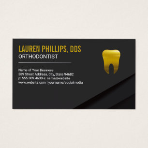 Icono de dientes dorados
