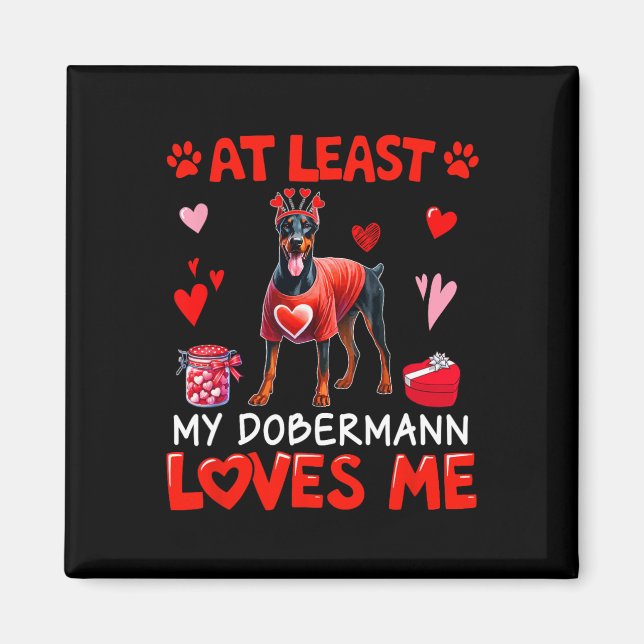 Imán Al menos mi Dobermann me ama en San Valentín solte (Frente)