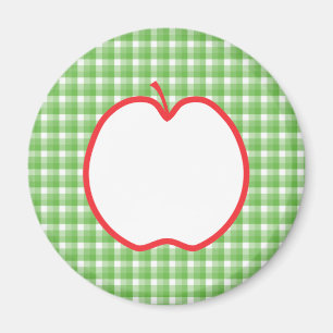 Imán Apple rojo. Con el fondo verde y blanco del