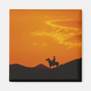 Imán Atardecer naranja con Silhouette Cowboy