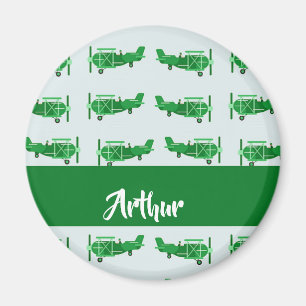 Imán Aviones voladores verdes sobre azul