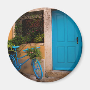 Imán Bicicleta azul y puerta en verano