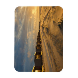 Imán Cabinas de playa al atardecer en la costa holandes