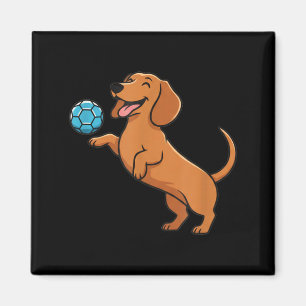 Imán Cachorro salchicha lindo jugando pelota de fútbol