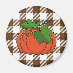 Imán Calabaza naranja sobre el patrón de cuadros de col