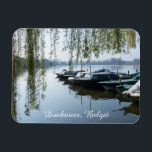 Imán Calm Spring Morning, Donk Lake Belgium<br><div class="desc">As the gentle light of a calm spring morning kisses the surface of Donk Lake in East Flanders, Belgium, the water reflects the soft blue of the sky. The beautiful weeping willow tree frames the scene with bright greens. Charming landscape photograph of this picturesque lake in Berlare. Great souvenir magnet....</div>