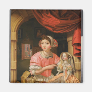 Imán Chica que sostiene una muñeca en un interior