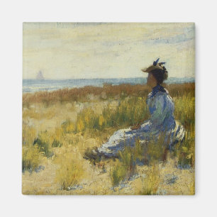 Imán Chica sentado junto al mar