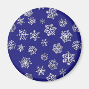Imán Copos de nieve blancos contra azul cobalto profund