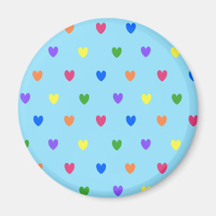 Imán Corazones de polka arcoiris sobre azul bebé