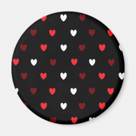 Imán corazones rojos y blancos sobre negro