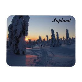 Imán Couché de soleil sur la forêt enneigée en Laponie
