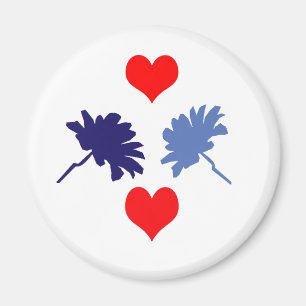 Imán de los corazones rojos y las flores azules