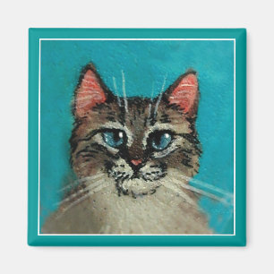 Imán de ojos azules lindo del gato
