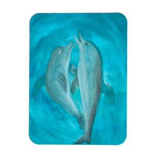 Imán Dos delfines jugando salvajes y libres en el océan