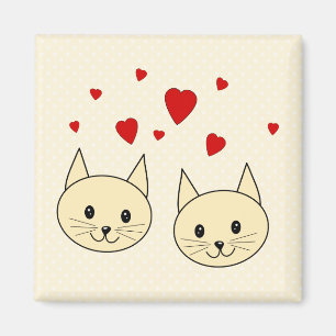 Imán Dos gatos de color ámbar con corazones rojos.