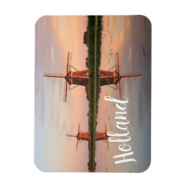 Imán Dos molinos de viento con reflexión al atardecer