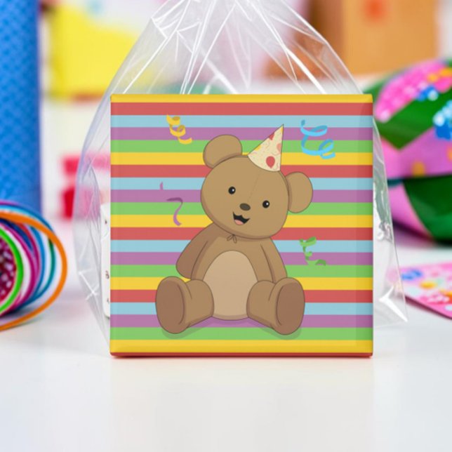 Imán Feliz Cumpleaños Teddy Magnet (Teddy bear magnet square, with a rainbow background and birthday hat. Leaned up against a favor bag.)