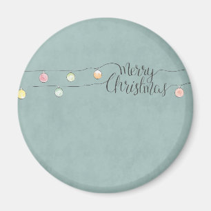 Imán Feliz Navidad con una serie de ornamentos