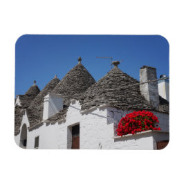Imán Flores de geranio y casas de trullos en Alberobell
