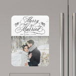 Imán Foto de recién casados en su primera Navidad<br><div class="desc">Letras de caligrafía elegante y romántica con ramitas de piña y una foto. ¡Para una personalización más avanzada de este diseño,  haga clic en el BOTÓN DE HERRAMIENTA DE DISEÑO AZUL de arriba!</div>