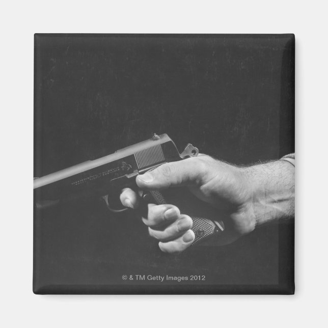 Imán Hombre sujetando un arma (Frente)