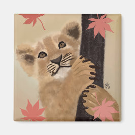 Imán Ímã filhote de leão brincando