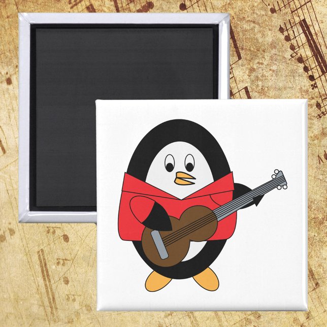 Imán Jugador de guitarra pingüino (A magnet with a cute guitar playing penguin.)