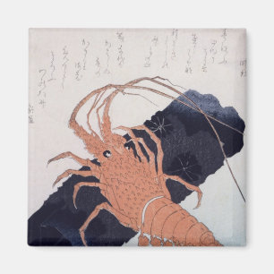 Imán Langoustine con un bloque del carbón de leña,