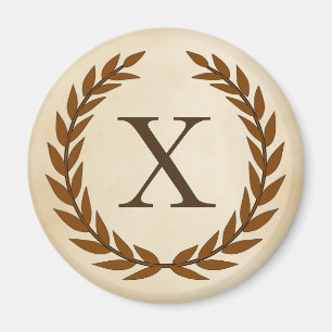 Imán Laurel Wreath sobre el monograma inicial del perga