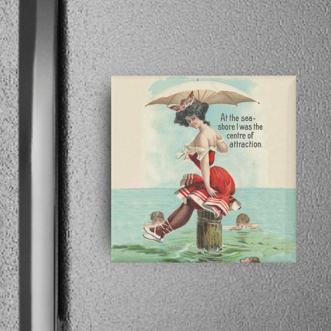Imán Magnate de belleza de baño victoriano (Victorian lady in red bathing suit with parasol on log in ocean with admirers on square magnet.)