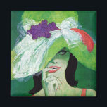 Imán Mirando hacia otro lado<br><div class="desc">Artista: Coby Whitmore | Mujer en un gorra verde con sonrisa coqueta.</div>