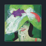 Imán Mirando hacia otro lado<br><div class="desc">Artista: Coby Whitmore | Mujer en un gorra verde con sonrisa coqueta.</div>