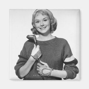 Imán Mujer que detiene al club de golf