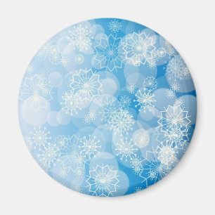 Imán Navidades con copos de nieve en un fondo azul