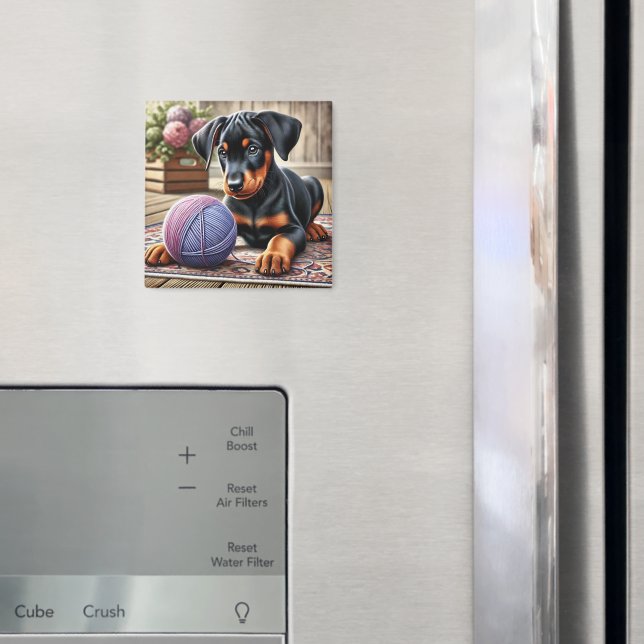 Imán Negro adorable y cachorro de Tan con pelota de yar (In situ (nevera))