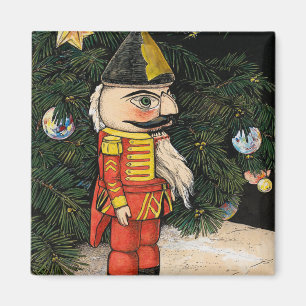 Imán Nutcracker de época bajo árbol de Navidad