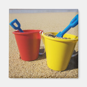 Imán Palas y cubos en la playa de Sandy